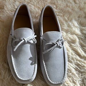 New light gray suede Tods gommino drivers with lace detail
